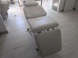 a room with a bed and a chair in it