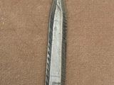 a knife that is laying on a table