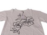 the t - shirt has a drawing of a flower on it