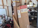 a pile of boxes and tools in a garage