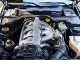 a car engine with the hood up and the hood down