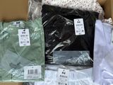 a box full of men ' s shirts in different colors and sizes