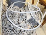 a pile of wires on the floor in a room