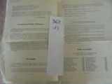 an open book with a piece of paper on top of it