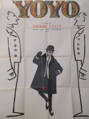 affiche de cinéma représentant un homme portant un haut-de-forme et un manteau