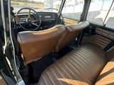 a view of the inside of a car with leather seats