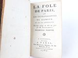 an open book with a title on it on a white surface