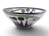 a black and white bowl with blue and green designs on it