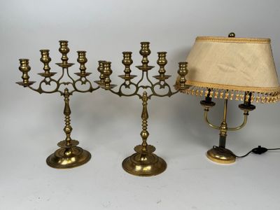 brass candlesticks with a lamp and a lamp shade on a white background