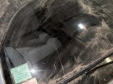 a dirty windshield of a car with a sticker on it