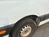a close up of the tire of a white van