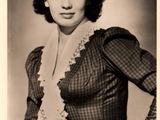 black and white photograph of a woman in a dress posing for a picture
