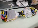 a skateboard that has been wrapped up on a table