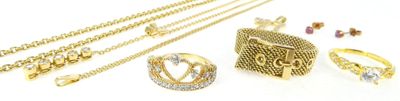 several different types of gold jewelry including rings, bracelets, and rings