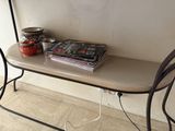 a small table with a book and a cup on it