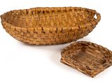 woven basket with lid on a white background