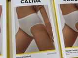 six boxes of calida underwear on display in a store
