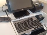 a computer sitting on top of a desk with a keyboard and mouse