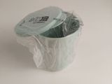 a plastic container with a lid on a white surface