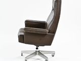 brown leather office chair with casteors and footrests against a white background