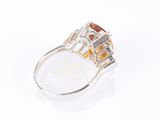 an image of a diamond and gold ring on a white background