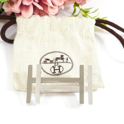 a small bag with a flower in it on a table