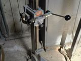 a machine that is sitting on the ground in a garage