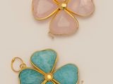 a set of three gold and turquoise enamel flower charms