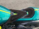 a close up of a motorcycle with a blue and yellow seat