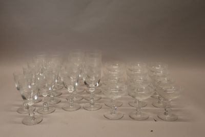 many empty wine glasses sitting on a white table
