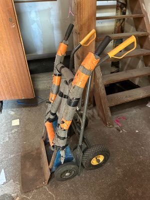 a hand truck that has a bunch of tools in it