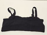 black sports bra top with adjustable straps on a white surface