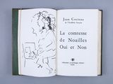 an open book with a drawing of a man holding a book