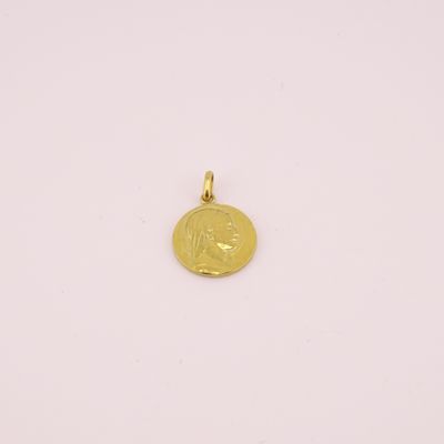 a gold coin with the face of a woman on it
