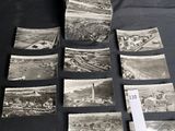several old black and white photographs of a city and a river