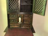 a small table with a small cabinet on top of it
