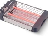 un gros plan d'un radiateur électrique posé sur une surface blanche