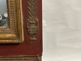 an antique wooden cabinet with a mirror on top of it