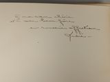 a book with a handwritten page on the front of it