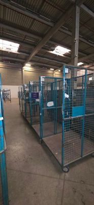 a large room with a lot of cages in it