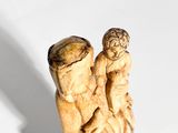 a statue of a man and a woman holding each other