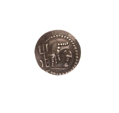 une vieille pièce d'argent sur laquelle figure l'effigie d'un homme