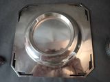 a silver plate that is sitting on a table