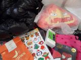 a pile of clothing and other items on the floor