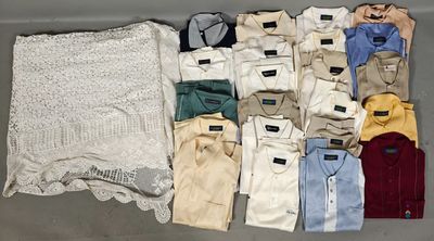 several pairs of men ' s clothing laid out on a table