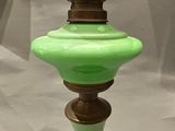 a green lamp that is on top of a table