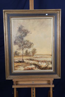 une peinture à l'huile représentant un arbre posé sur un chevalet, sur fond bleu
