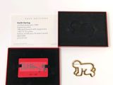a box with a keychain that has a picture of a dog on it
