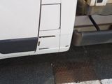 a white van parked on the side of the road