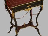 a small table with a book on top of it